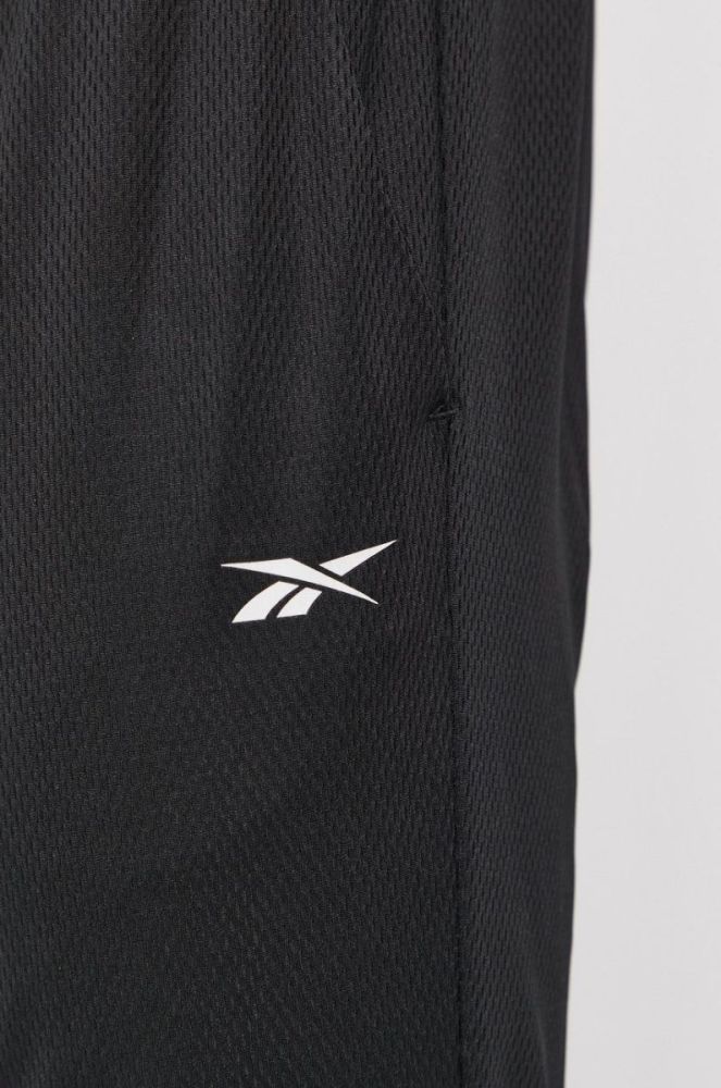 Штани Reebok FP9120 чоловічі колір чорний гладке фото 4