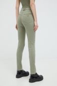 Штани Guess жіночі колір зелений облягаюче середня посадка