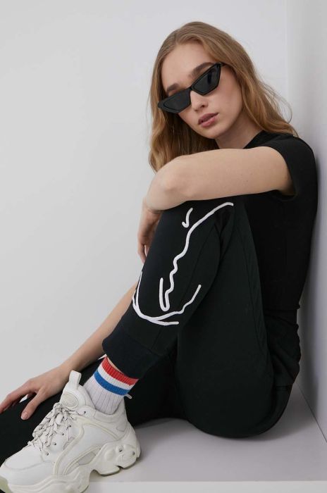 Штани Karl Kani жіночі колір чорний з аплікацією