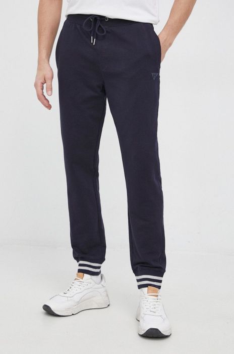 Штани Guess чоловічі колір синій гладке