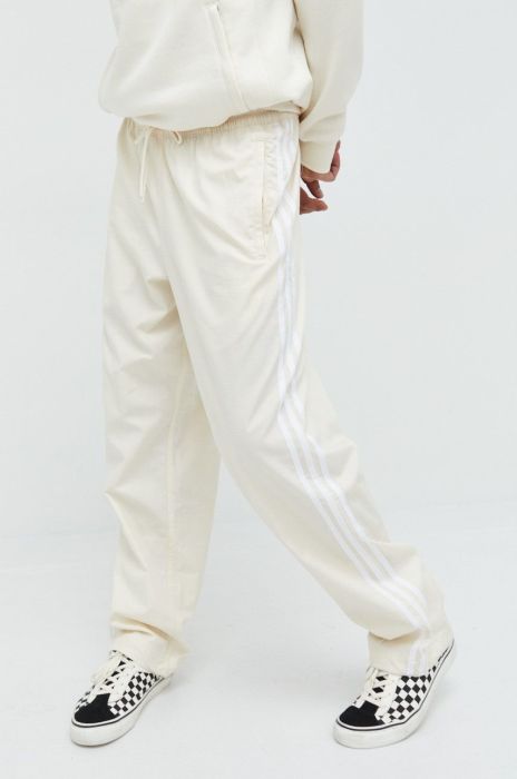 Бавовняні спортивні штани adidas Originals чоловічі колір бежевий з аплікацією