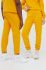 Бавовняні спортивні штани Arkk Copenhagen колір жовтий однотонні