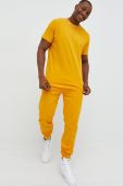Бавовняні спортивні штани Arkk Copenhagen колір жовтий однотонні