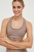 Спортивний бюстгальтер Reebok Lux колір коричневий візерунок Спортивний бюстгальтер Reebok Lux колір коричневий візерунок