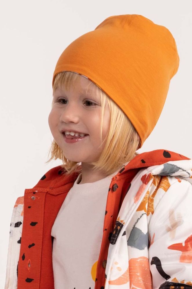 Дитяча двостороння шапка Coccodrillo колір помаранчевий з тонкого трикотажу