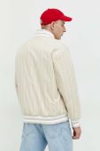 Куртка-бомбер Tommy Jeans чоловічий колір бежевий перехідна oversize