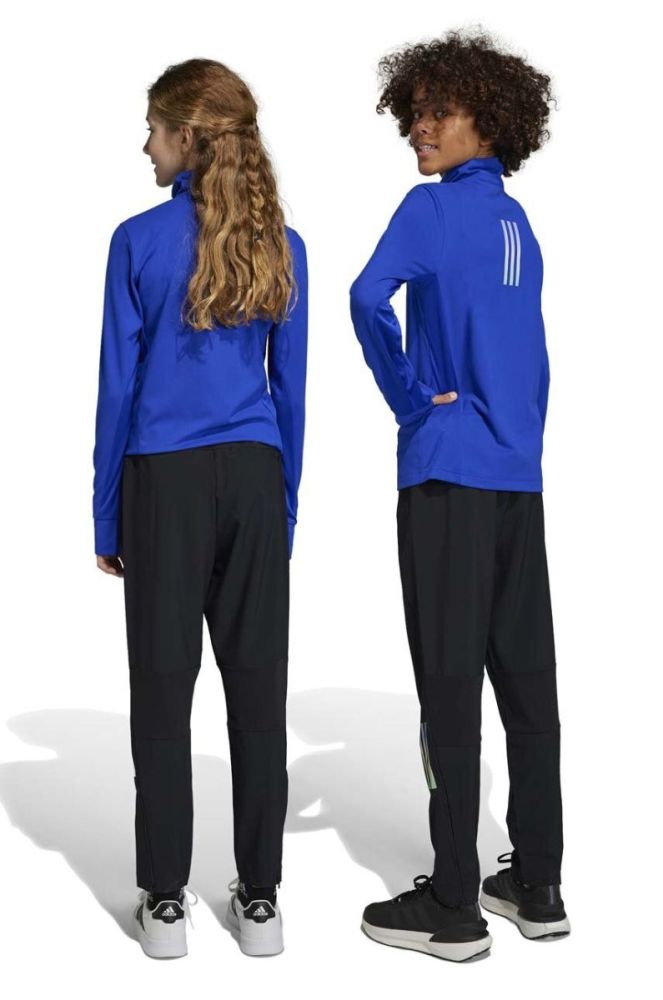 Дитячі спортивні штани adidas U RUN WV колір чорний з принтом фото 5
