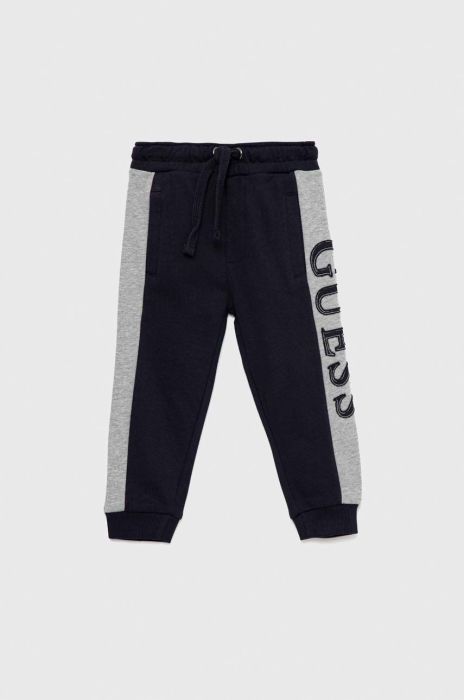 Дитячі бавовняні штани Guess колір синій з аплікацією