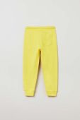 Дитячі бавовняні штани OVS колір жовтий однотонні