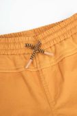 Дитячі бавовняні штани Coccodrillo колір жовтий однотонні (2985019)