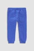 Дитячі спортивні штани Coccodrillo колір синій з принтом