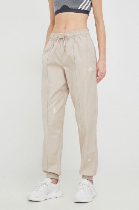 Бавовняні штани adidas жіночі колір бежевий однотонні