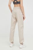 Бавовняні штани adidas жіночі колір бежевий однотонні