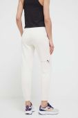 Бавовняні спортивні штани Puma колір бежевий однотонні