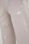Бавовняні спортивні штани adidas колір рожевий однотонні