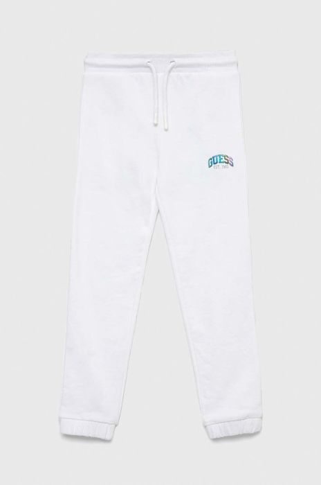 Дитячі бавовняні штани Guess колір білий однотонні