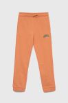 Дитячі бавовняні штани Guess колір помаранчевий однотонні