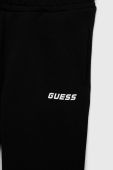 Дитячі бавовняні штани Guess колір чорний з принтом (2937507)