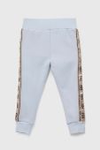 Дитячі спортивні штани Guess з аплікацією колір блакитний