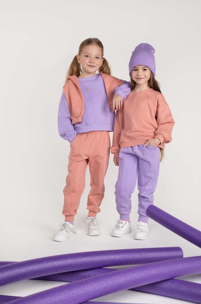 Дитячі бавовняні штани Coccodrillo колір фіолетовий однотонні (2990870)