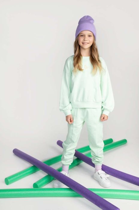 Дитячі бавовняні штани Coccodrillo колір бірюзовий однотонні