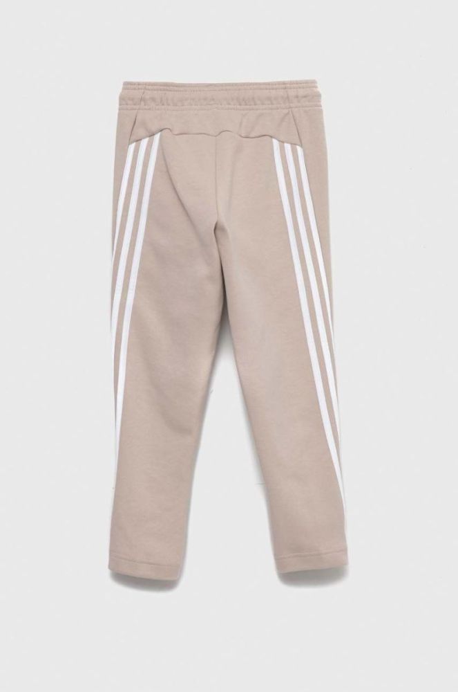 Дитячі спортивні штани adidas U FI 3S колір бежевий з аплікацією фото 3