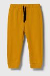 Дитячі бавовняні штани United Colors of Benetton колір жовтий однотонні (3387916)