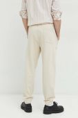 Бавовняні спортивні штани Tommy Jeans чоловічі колір бежевий однотонні