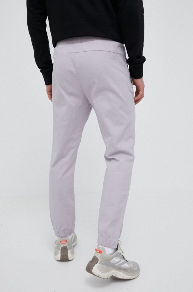Штани 4F чоловічі колір рожевий однотонні фото 3