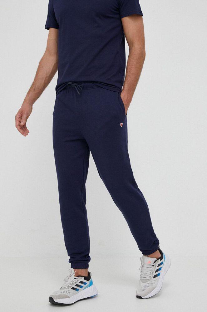 Бавовняні спортивні штани Hummel колір синій з аплікацією