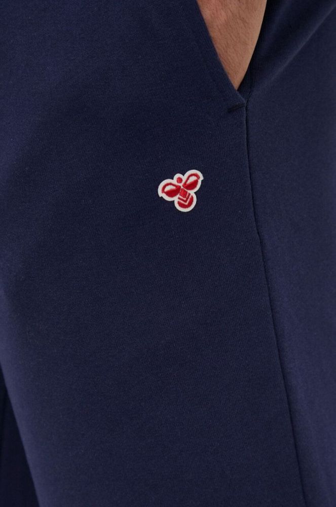Бавовняні спортивні штани Hummel колір синій з аплікацією фото 4
