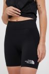 Спортивні шорти The North Face жіночі колір чорний однотонні середня посадка Спортивні шорти The North Face жіночі колір чорний однотонні середня посадка
