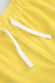 Дитячі шорти Coccodrillo колір жовтий однотонні регульована талія (3177104)