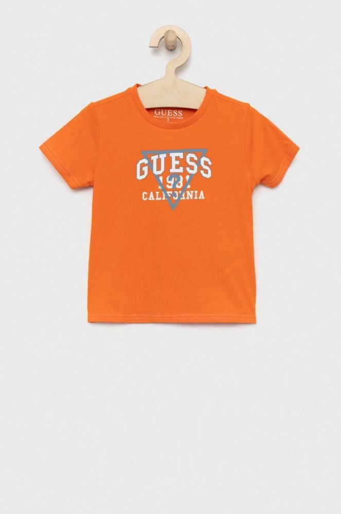 Дитяча бавовняна футболка Guess колір помаранчевий з принтом (2871381)