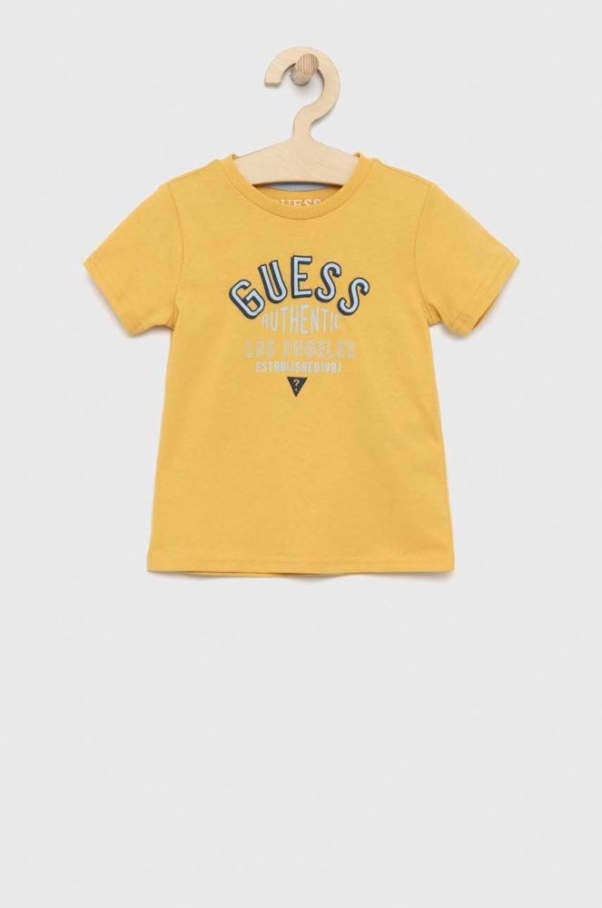 Дитяча бавовняна футболка Guess колір жовтий з принтом (2898326)