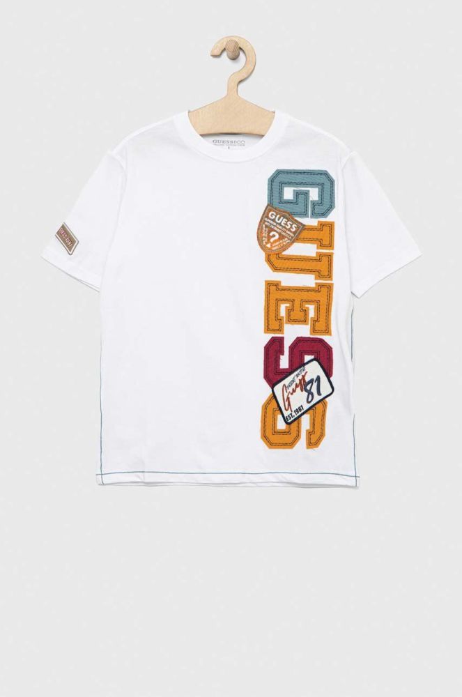 Дитяча бавовняна футболка Guess колір білий з аплікацією (3133355)