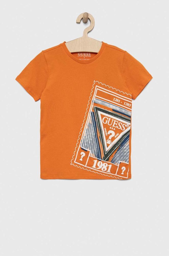 Дитяча бавовняна футболка Guess колір помаранчевий з принтом (3046494)