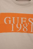 Дитяча бавовняна футболка Guess колір бежевий з принтом (3009495)