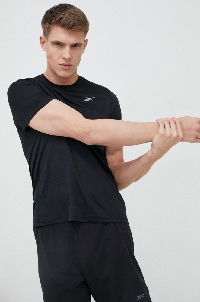 Бігова футболка Reebok колір чорний з принтом фото 4